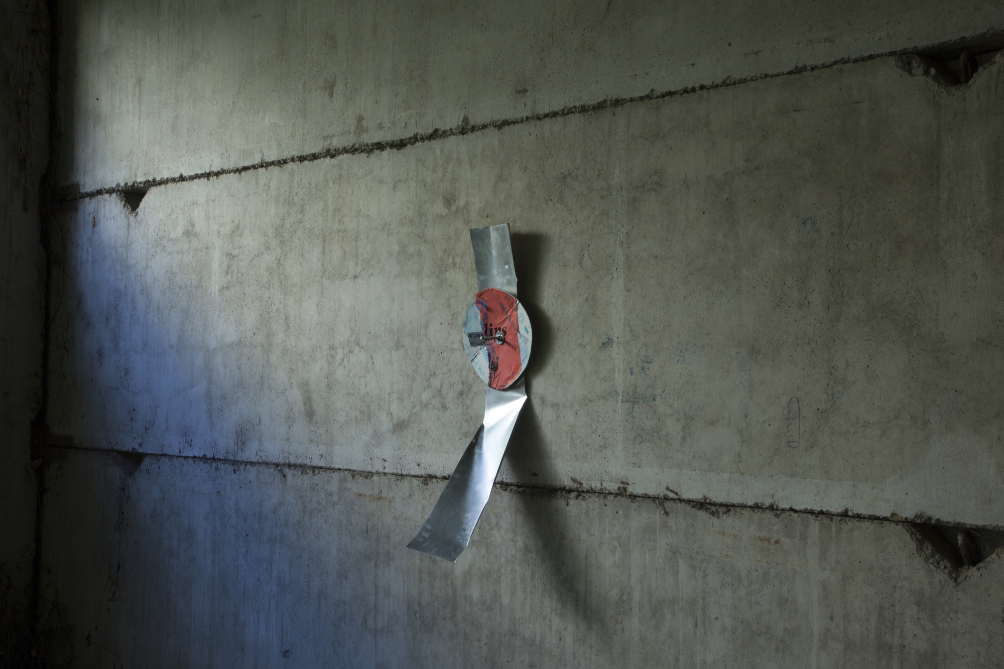 Lips | 2015 | photograph, plastic bags, cardboard, metal, concrete bolt | 110 x 30 cm | https://phelimmcconigly.net/?page_id=39