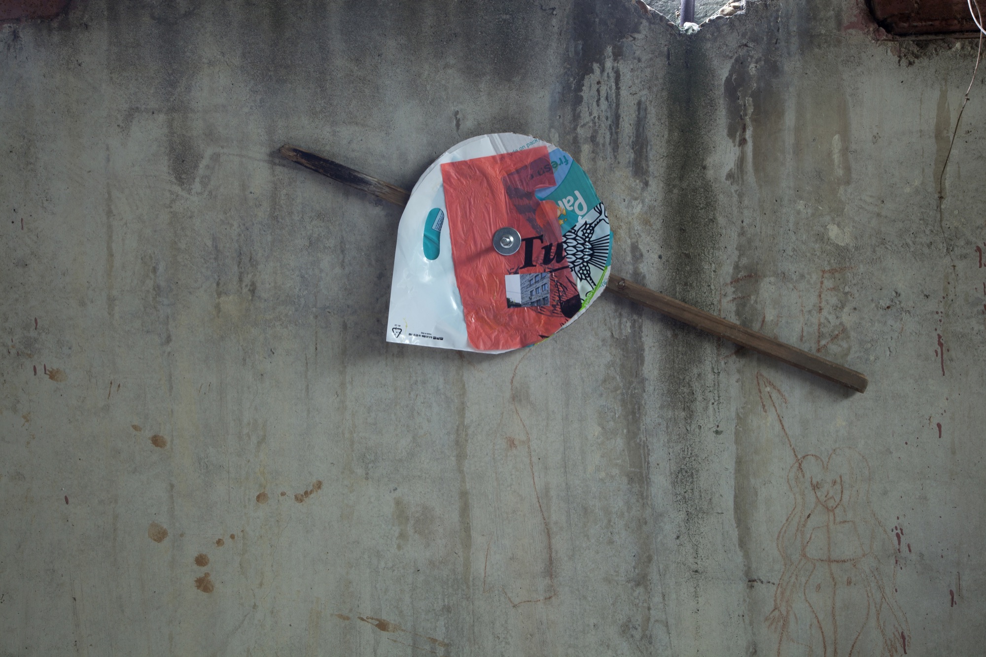 Tu | 2015 | photograph, plastic bags, cardboard, wood, concrete bolt | 50 x 70 cm | https://phelimmcconigly.net/?page_id=39