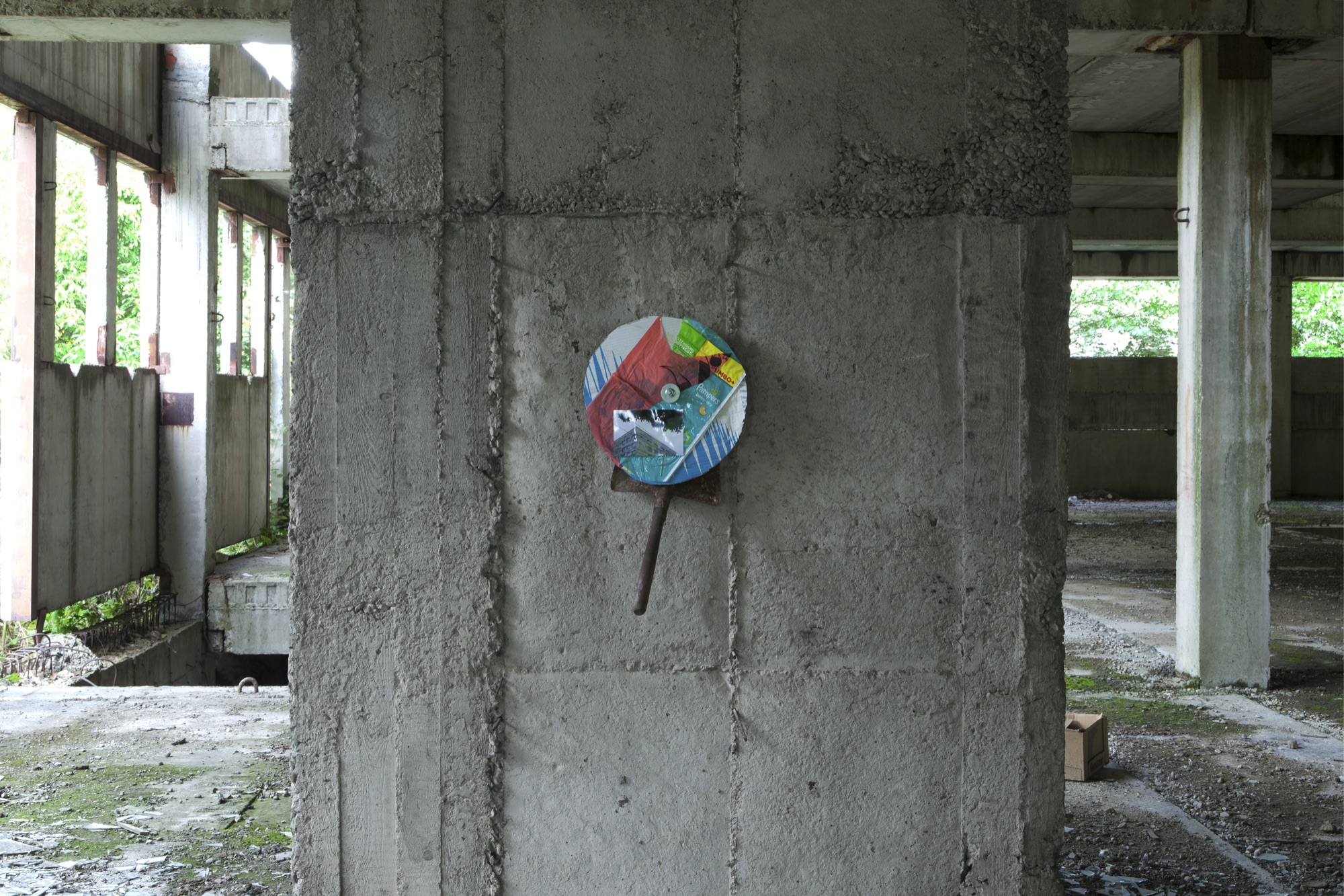 Umbo+ | 2015 | photograph, plastic bags, cardboard, metal, concrete bolt | 30 x 60 cm | https://phelimmcconigly.net/?page_id=39