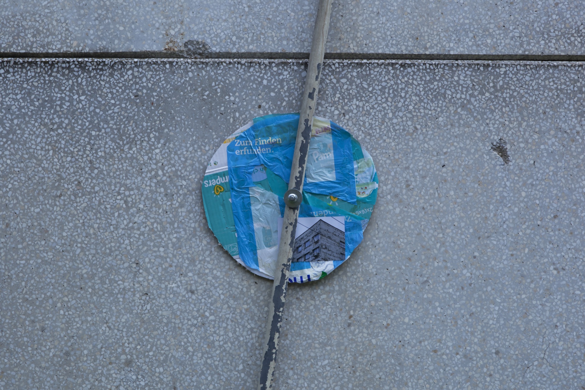 Zum Finden erfunden | 2015 | photograph, plastic bags, cardboard, metal, concrete bolt | 200 x 50 cm | https://phelimmcconigly.net/?page_id=39